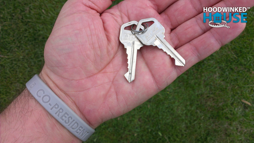 New house keys in the palm of a hand