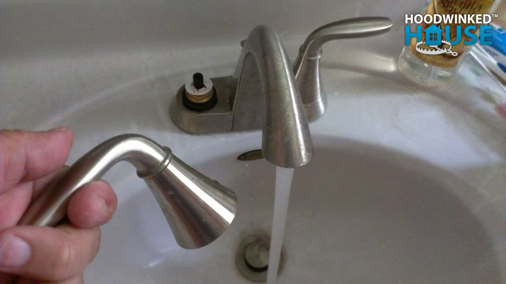 Handle that has come off a running bathroom faucet