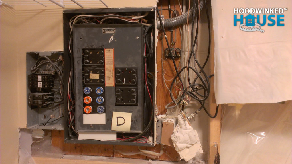 Telephone and cable TV connections covered in globs of drywall mud