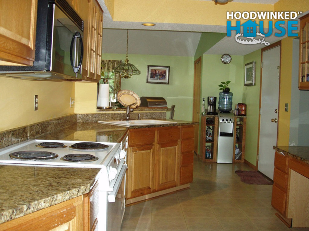 Kitchen with corner sink and dining room with closet.