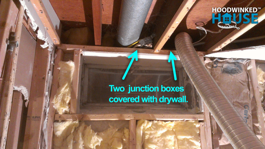 Annotated photo of a demolished ceiling revealing two junction boxes covered by drywall