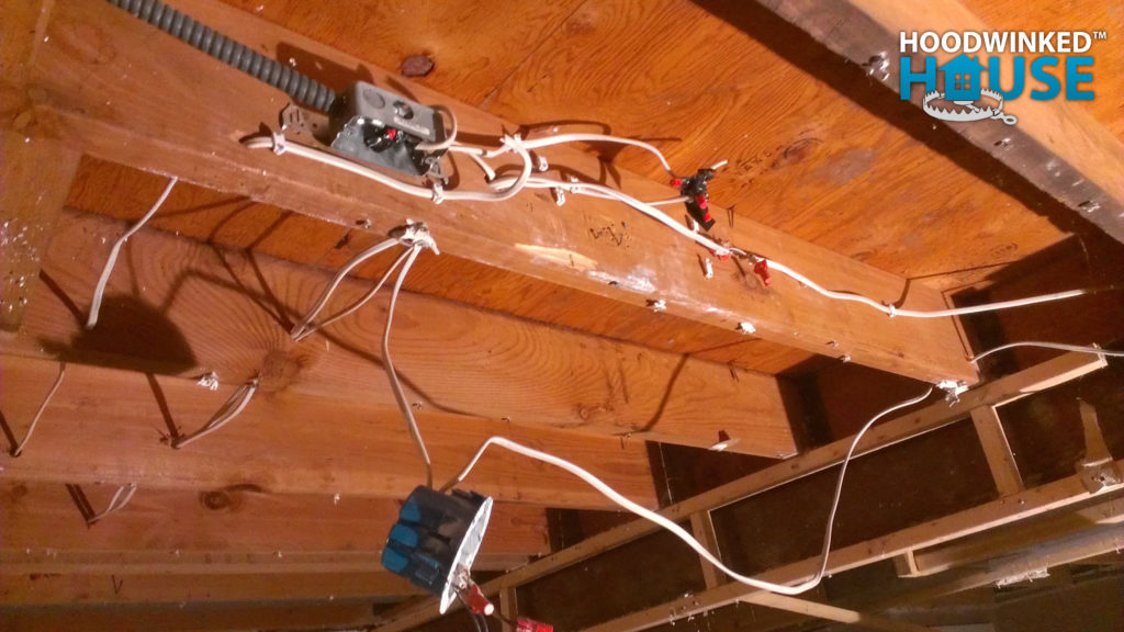 Junction box that was concealed by ceiling drywall.