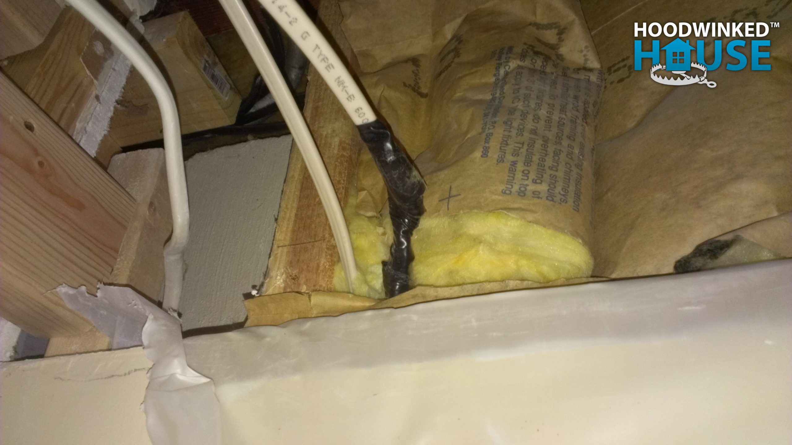 Spliced wires without a junction box discovered behind drywall.
