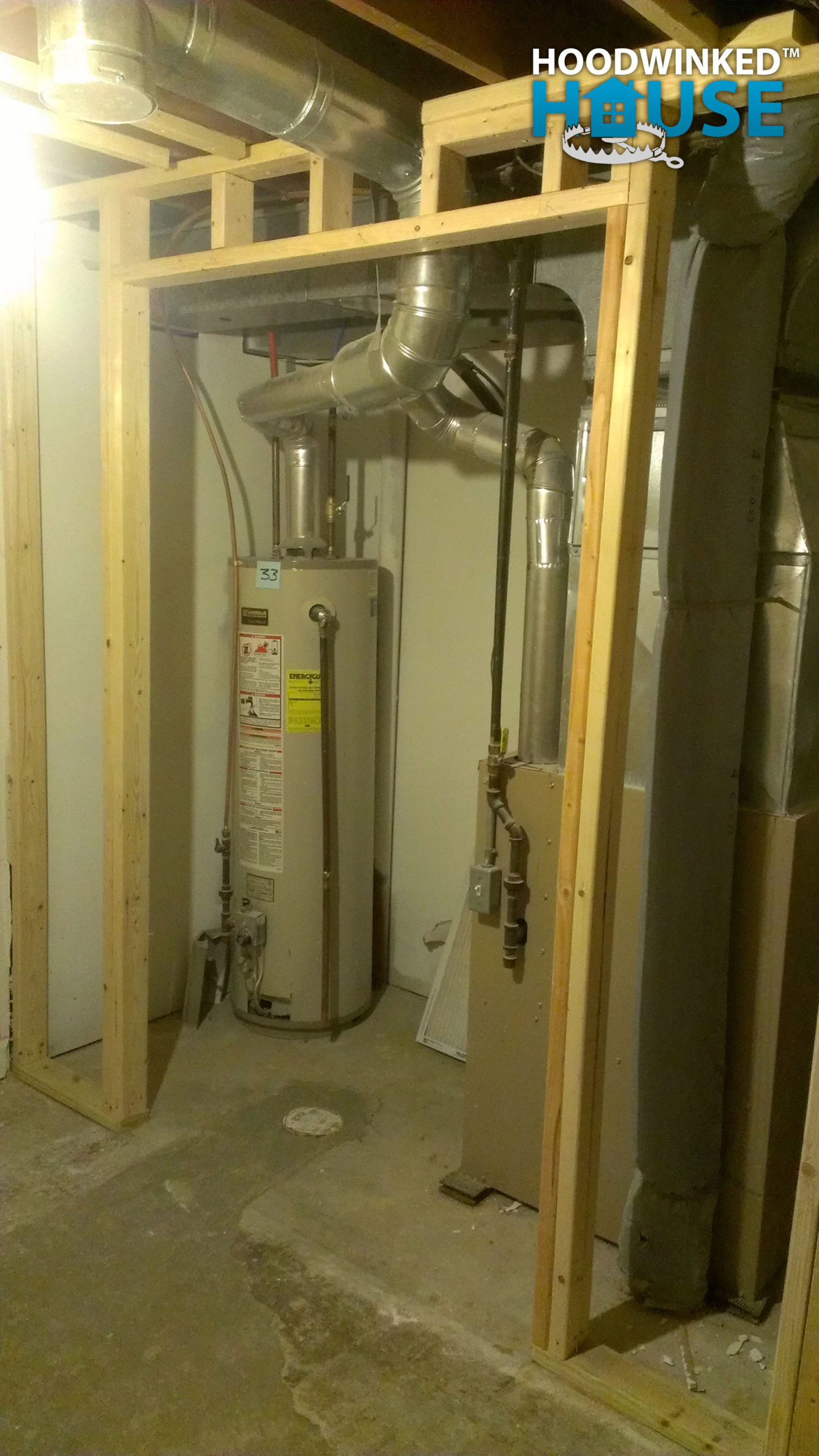 Framing in a basement around the water heater and furnace.
