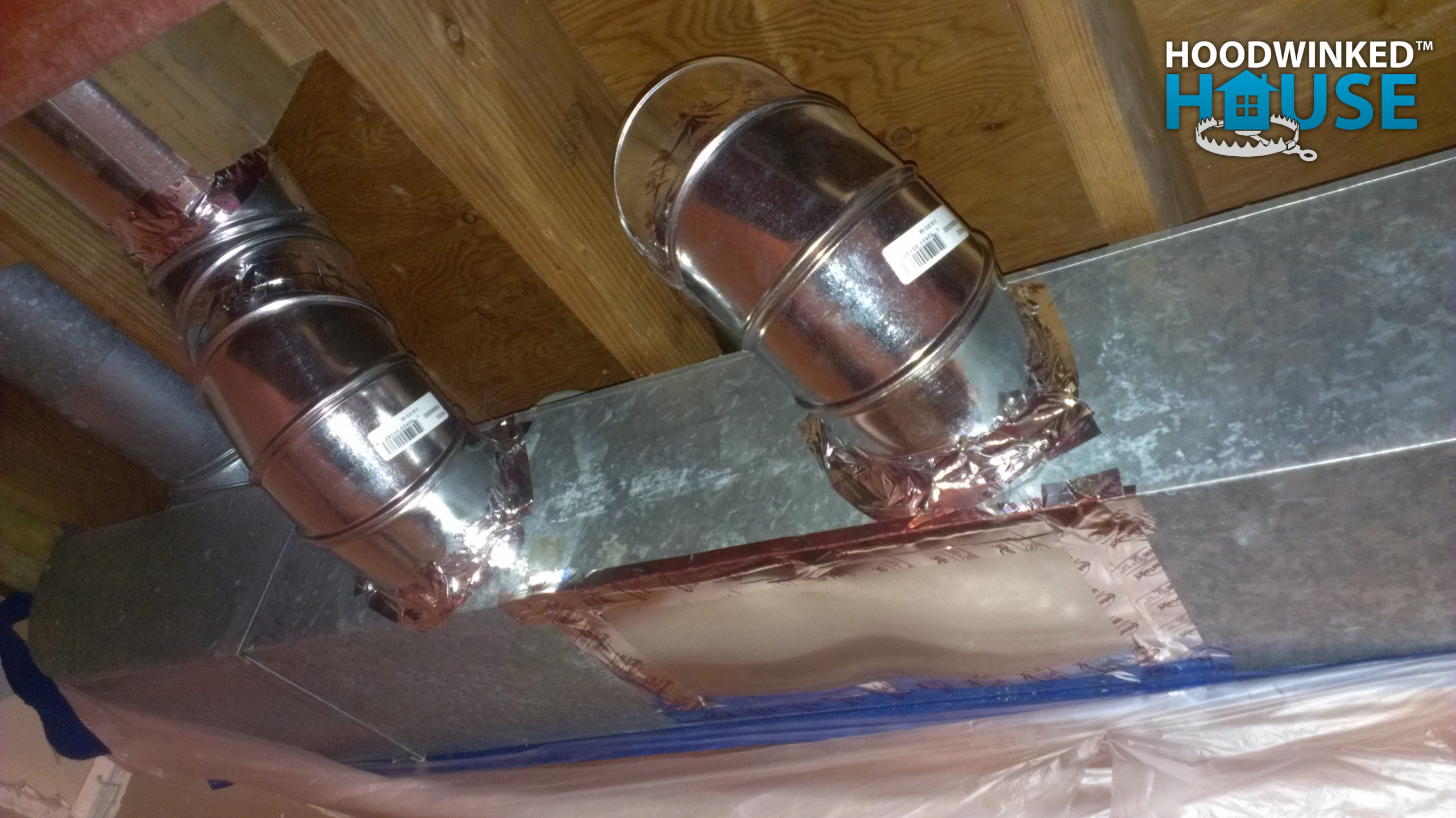 A basement air duct has been repaired with a patch, and two new branches have been added.