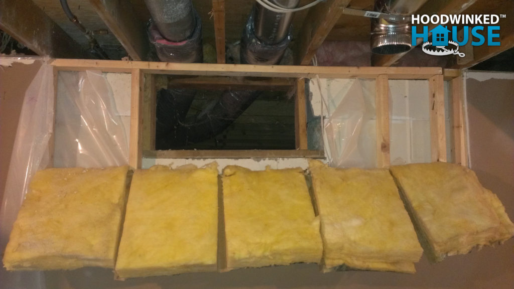 Drywall and framing demolition reveals crawlspace access that had been illegally concealed.