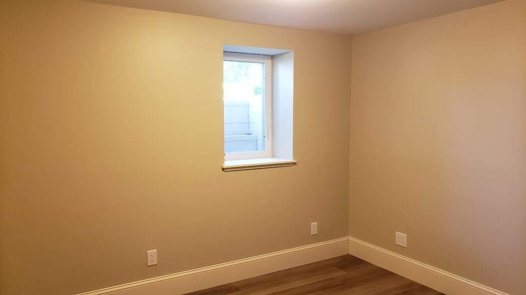 An egress window in a basement bedroom.