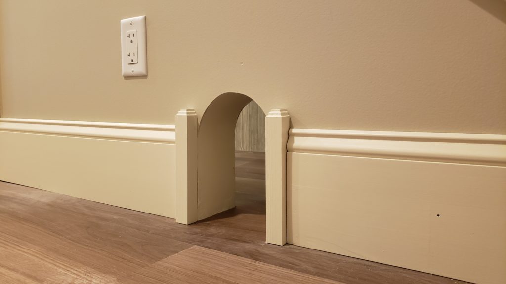 A pet portal is a small archway that allows pets to move between rooms, even when doors are closed.