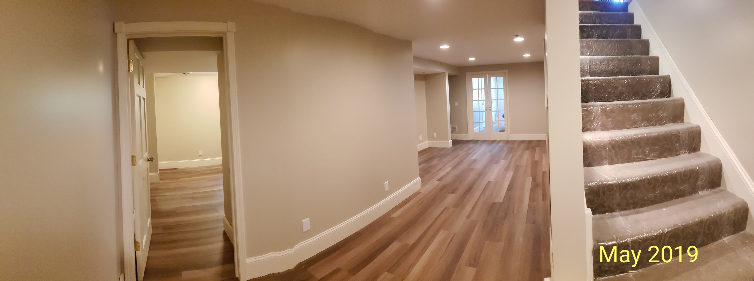 Panoramic view of a finished basement as seen in May of 2019.