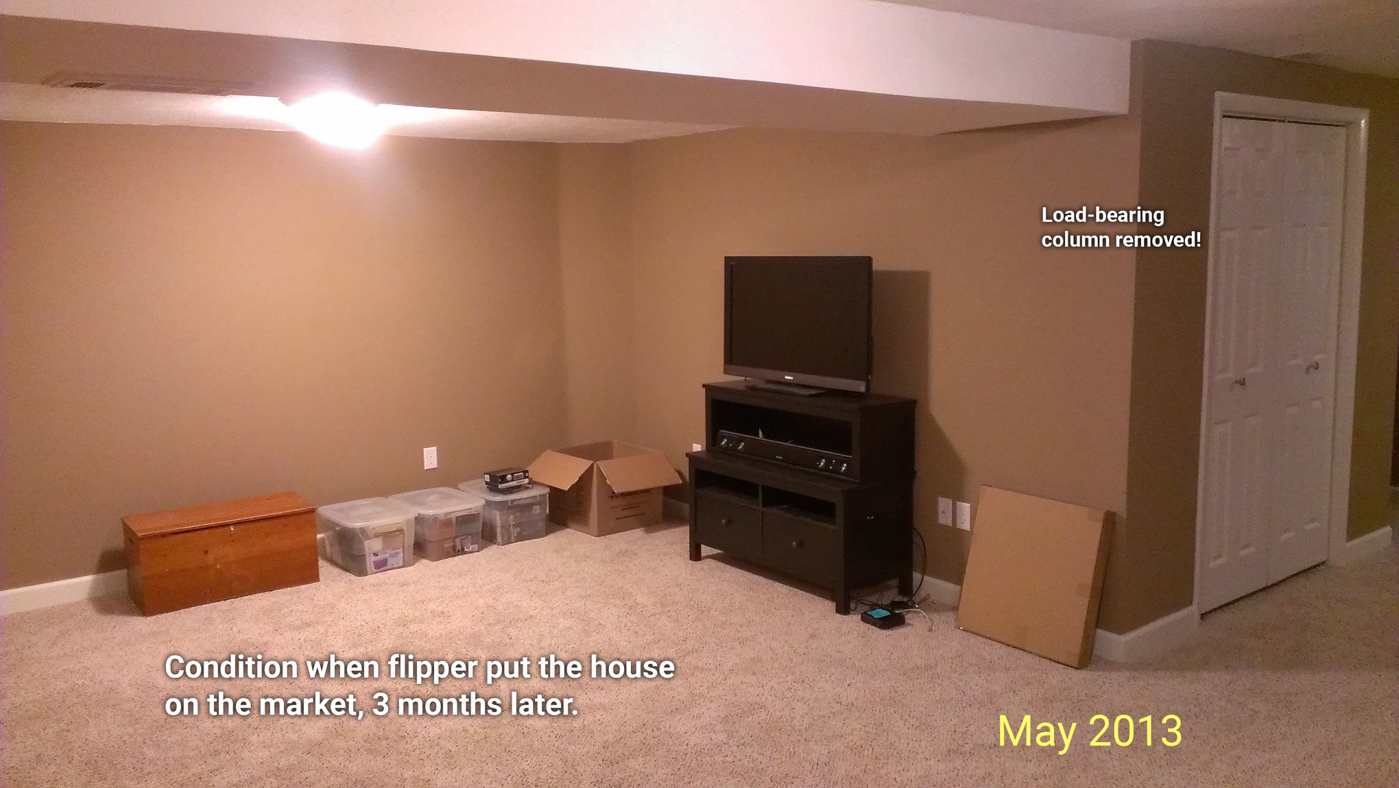 A basement room showing the condition of the house when a flipper put it back on the market in May of 2013. A load bearing column has been removed and is missing from the photo.