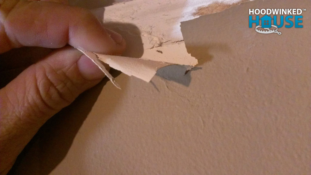 Paint peeling off a wall without primer
