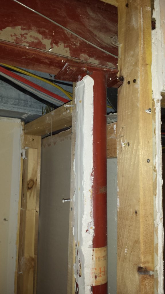 Drywall mud over 1 inch thick caked to a basement support column.