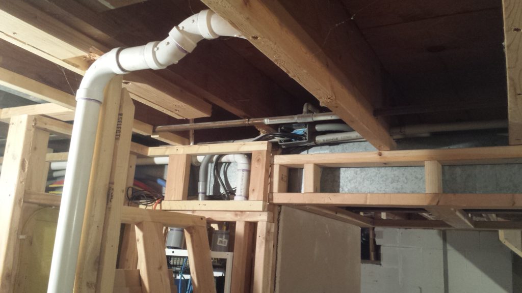 This overhead drain pipe will be simplified by reframing the wall in a better spot.