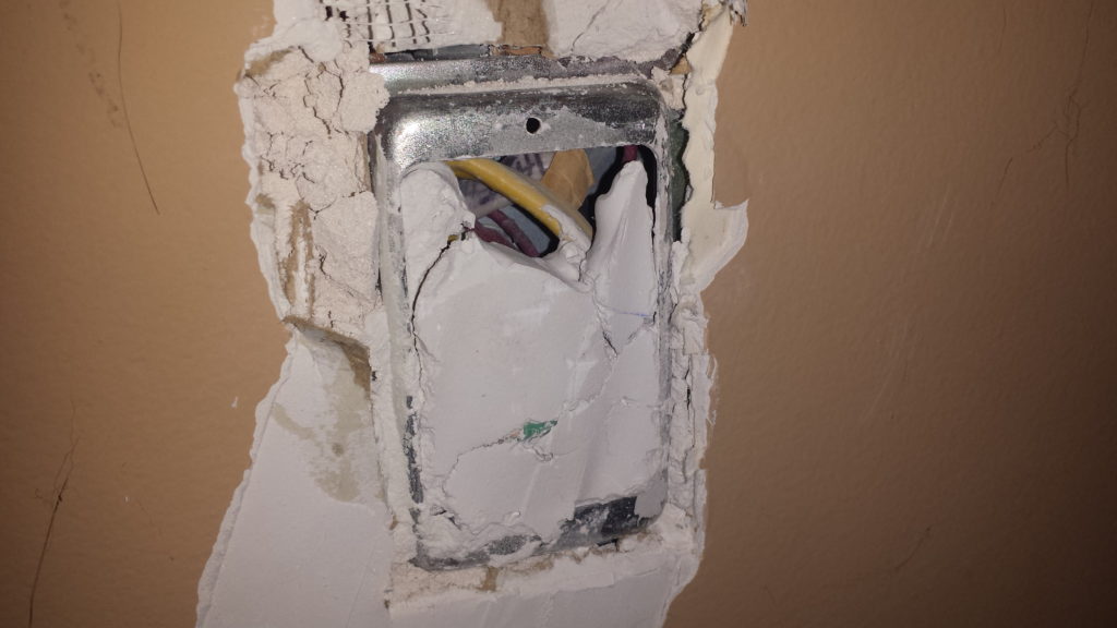 Junction box filled with drywall mud.