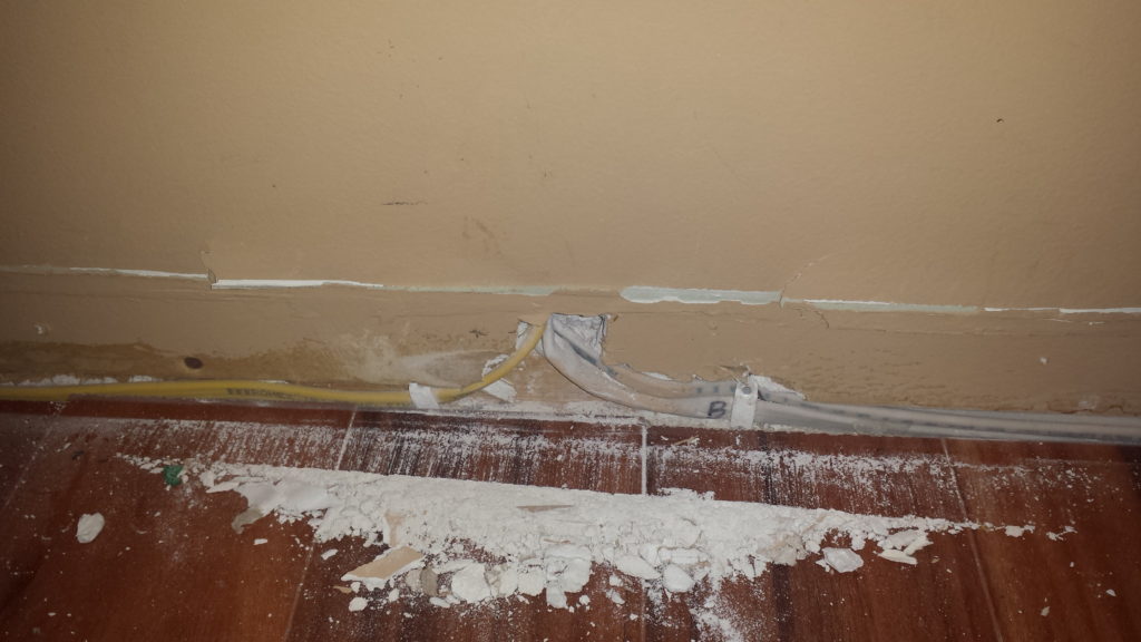 Wires hidden behind baseboards.