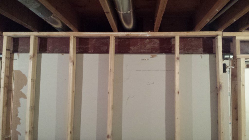 A stud wall with studs that aren't evenly spaced 16 inches apart.