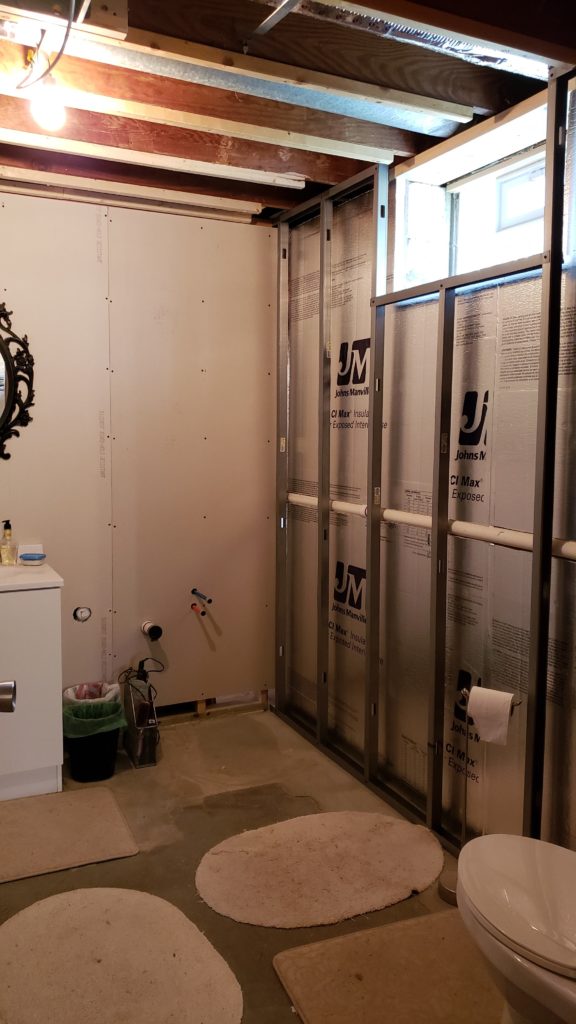 Metal stud framing in a basement bathroom.