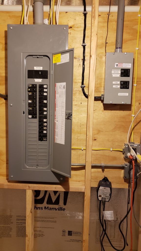Framing around electrical service panels in a basement.