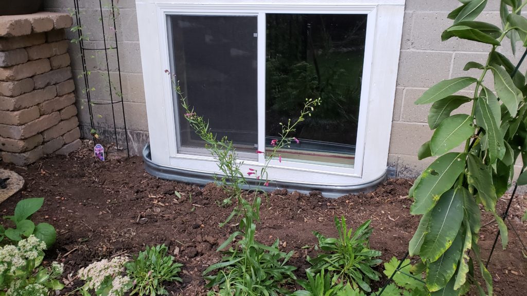 A basement window with a window well.