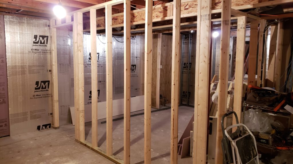 Stud wall framing in a basement.