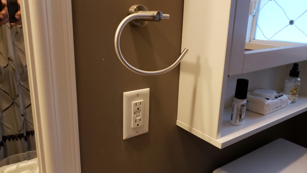 An outlet in a bathroom.