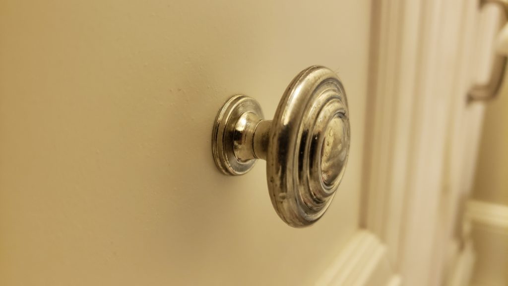 A silver drawer pull knob.