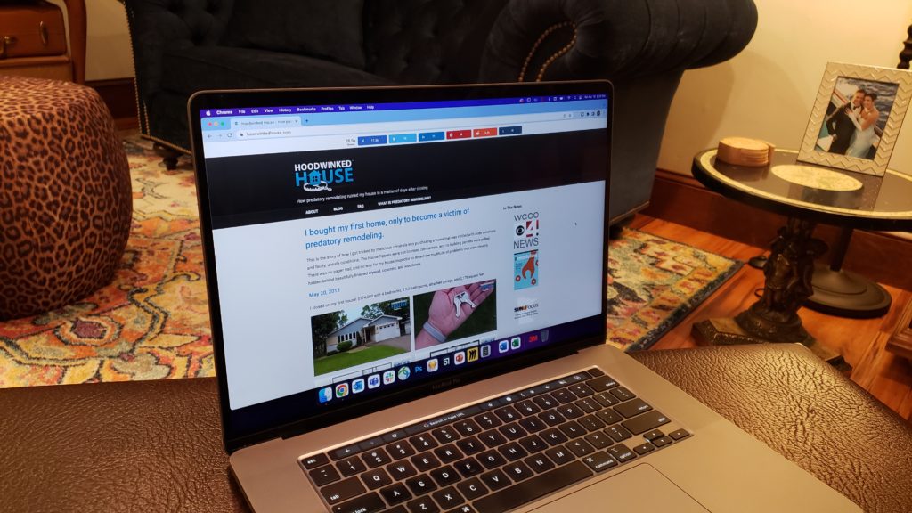 A laptop showing the Hoodwinked House website.